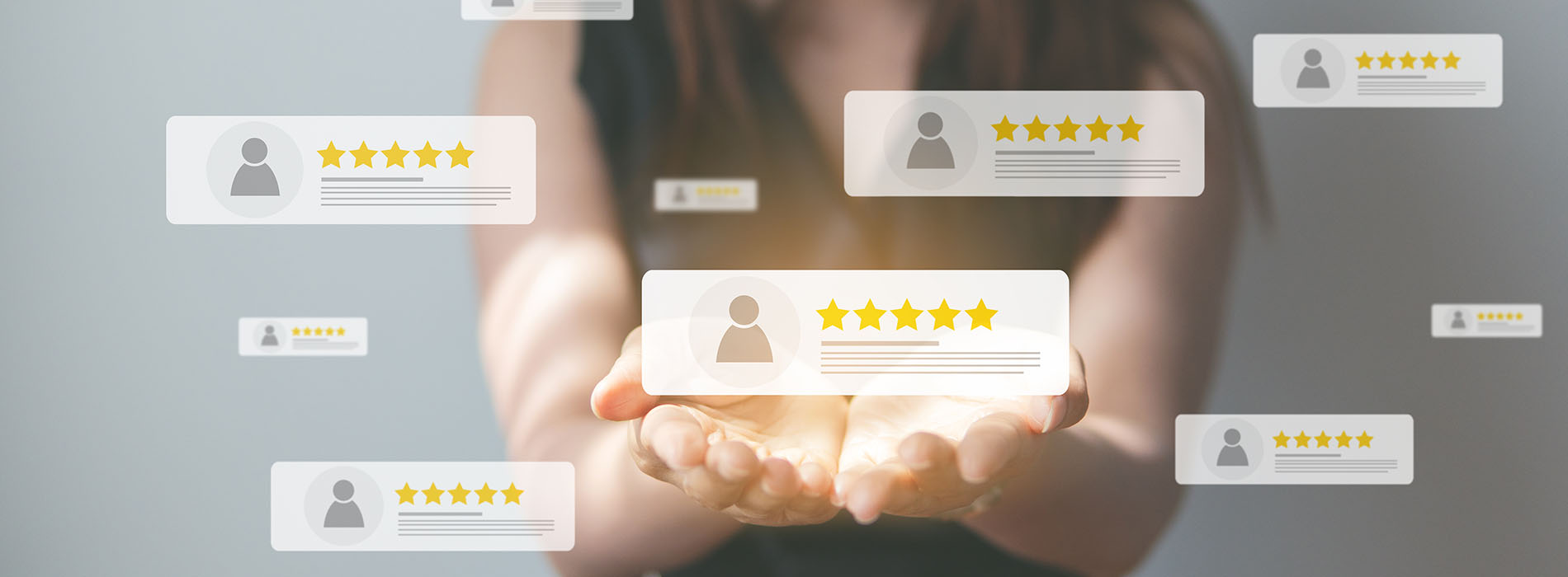The image shows a person s hand reaching out towards several digital icons with star ratings, suggesting an interactive user experience possibly related to reviews or ratings within a website or app context.